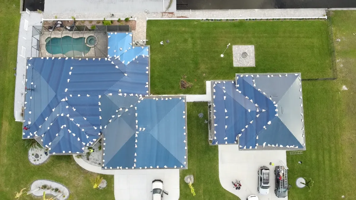 Aerial view of multi-structure tarping project