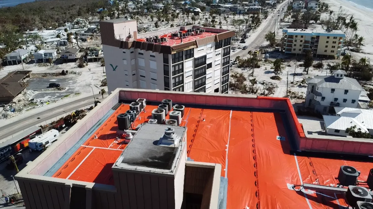 Emergency tarping on coastal commercial building