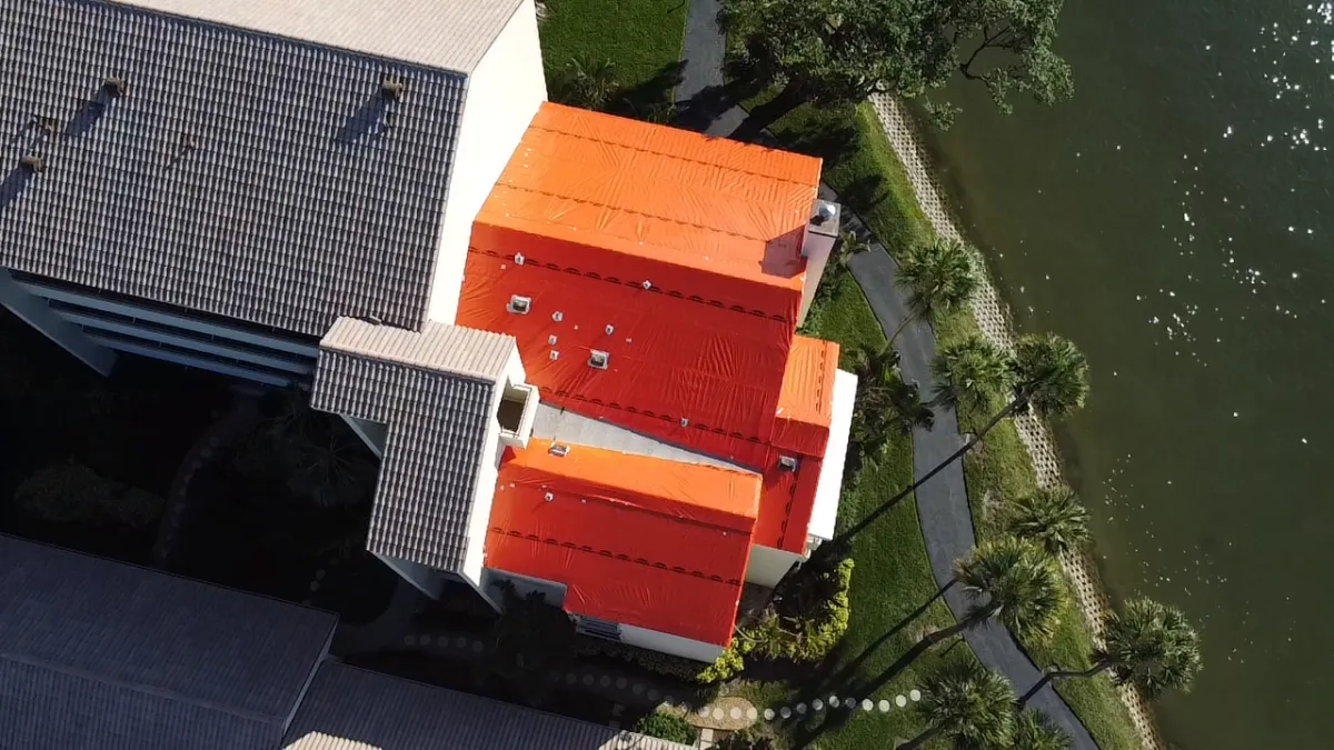 Orange tarp on waterfront property